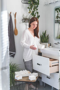 Portrait of young woman working at home