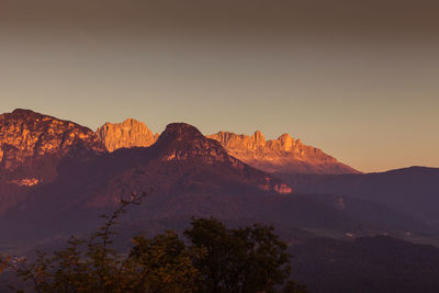 Scenic view of mountains against clear sky during sunset