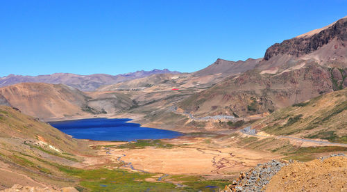 Scenic view of mountains against clear blue sky