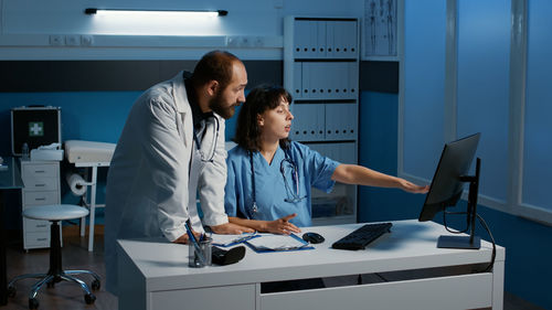 Female doctor working in office