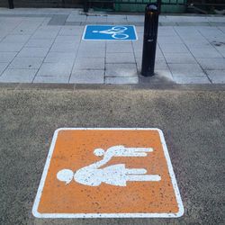 High angle view of road sign on parking lot