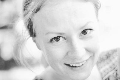 Close-up portrait of a smiling young woman