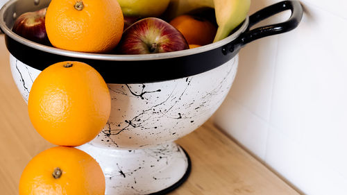 High angle view of oranges in bowl on table