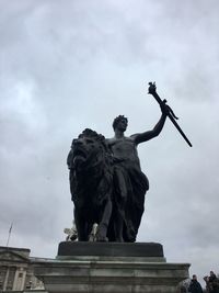 Low angle view of statue against sky