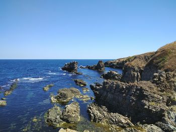 Scenic view of sea against clear sky