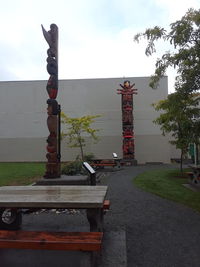 View of cross on road against sky