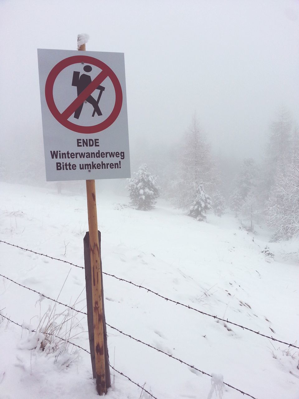 snow, winter, cold temperature, text, communication, western script, weather, season, sign, warning sign, white color, road sign, information sign, guidance, covering, field, information, nature, landscape, pole