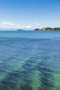 Scenic view of sea against blue sky