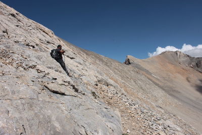 Full length of man on mountain against sky