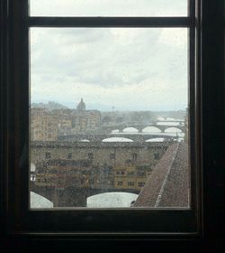 Cityscape seen through glass window