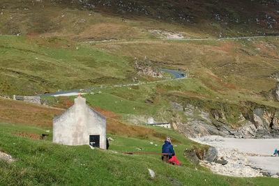 Rear view of woman on landscape against mountain