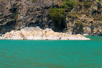 Scenic view of rocks by sea
