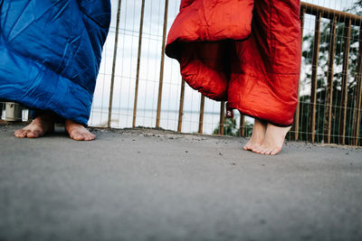 Low section of woman standing on tiled floor