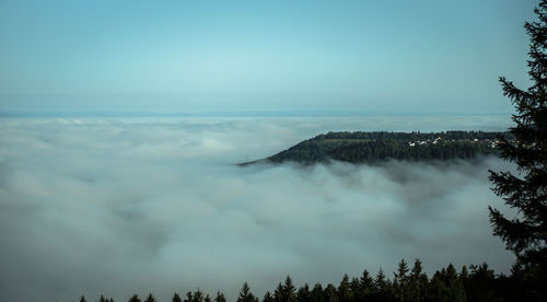 Scenic view of mountains against blue sky