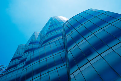 Low angle view of modern buildings against sky