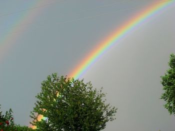 Low angle view of rainbow against sky