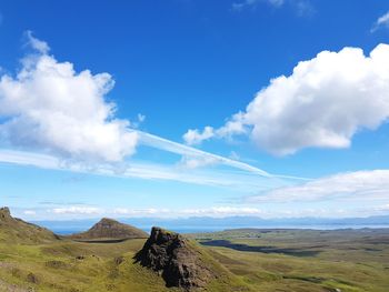 Scenic view of landscape against blue sky