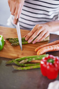 Midsection of woman preparing food on table