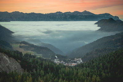 High angle view of trees and mountains against sky during sunset