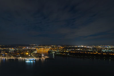 Illuminated buildings in city at night