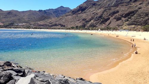 Scenic view of beach against mountains