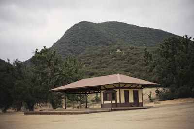 Built structure on mountain against sky
