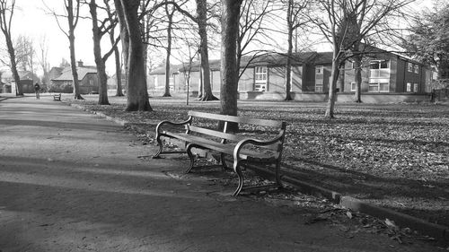 Empty road with buildings in background