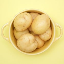 Close-up of eggs in bowl against white background