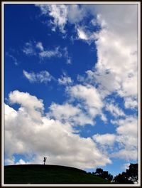 Scenic view of landscape against cloudy sky