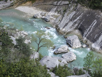 High angle view of waterfall by river