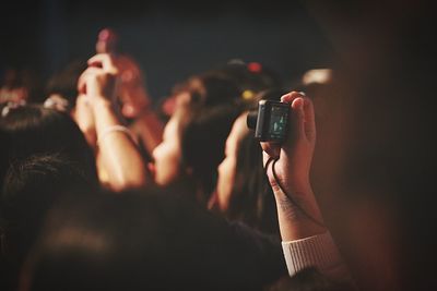 Woman photographing through smart phone