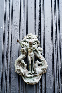 Close-up of old sculpture on wooden door