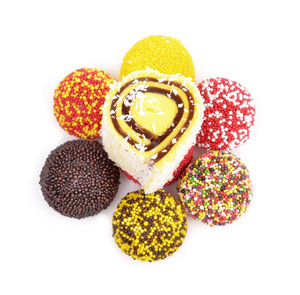 Directly above shot of multi colored candies against white background