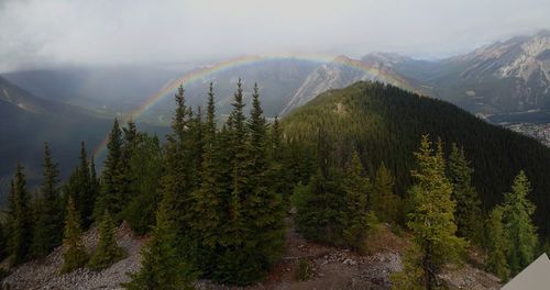 Scenic view of rainbow over mountain range