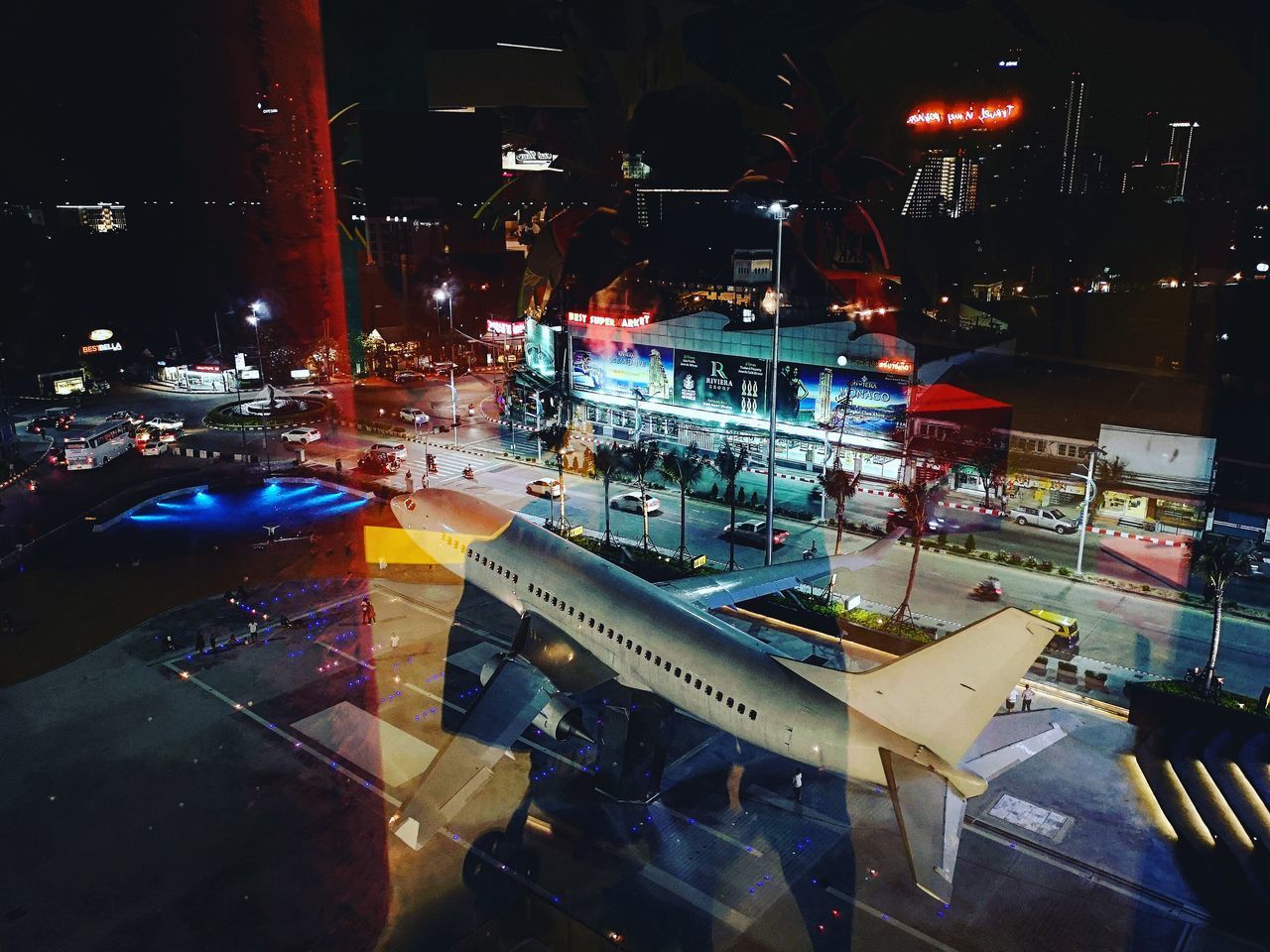 HIGH ANGLE VIEW OF ILLUMINATED STREET IN CITY AT NIGHT