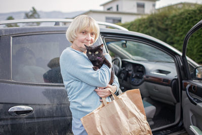 Ukrainian refugees flee from russian invasion, cross board by car together with pet, seek protection