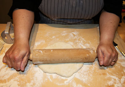 Midsection of man preparing food