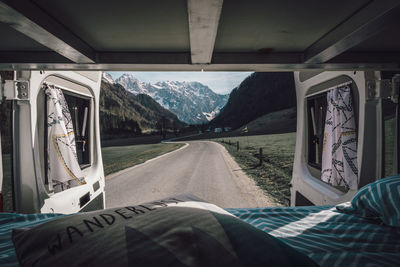 Mountains and road seen through van