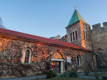 Low angle view of old building against clear sky