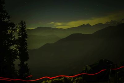 Scenic view of landscape against sky at night