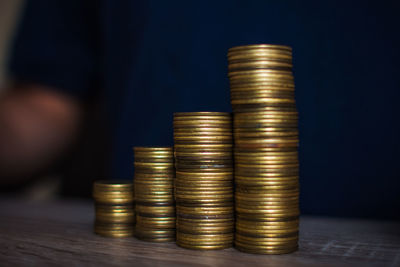 Close-up of stacked coins on table