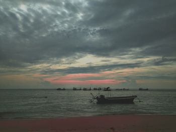 Scenic view of sea against cloudy sky