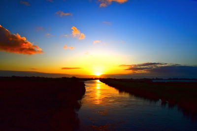 Scenic view of sea against romantic sky at sunset