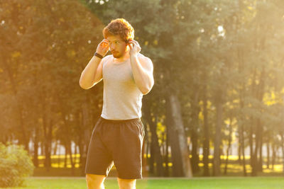 Full length of young man standing outdoors