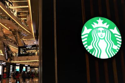 Low angle view of illuminated sign on street