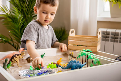 High angle view of cute girl painting on table