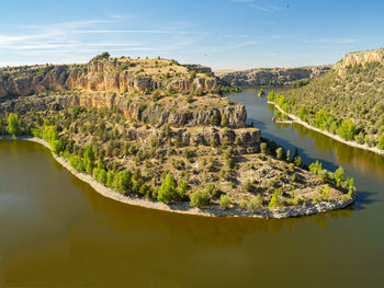 Scenic view of river passing through mountain