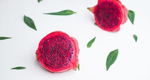 High angle view of strawberries on table against white background