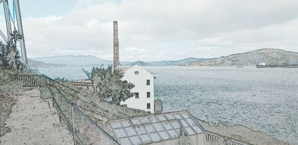 Panoramic view of sea and buildings against sky