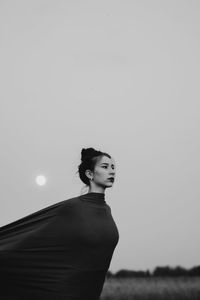 Woman standing against sky